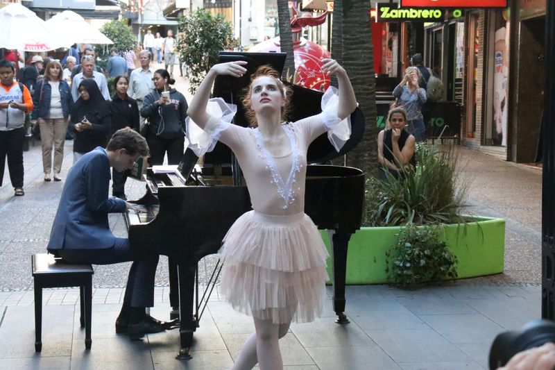 Dancers performing on Queen Street at Christmas