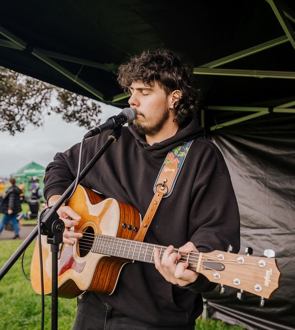 Jimmy performing live with an acoustic guitar
